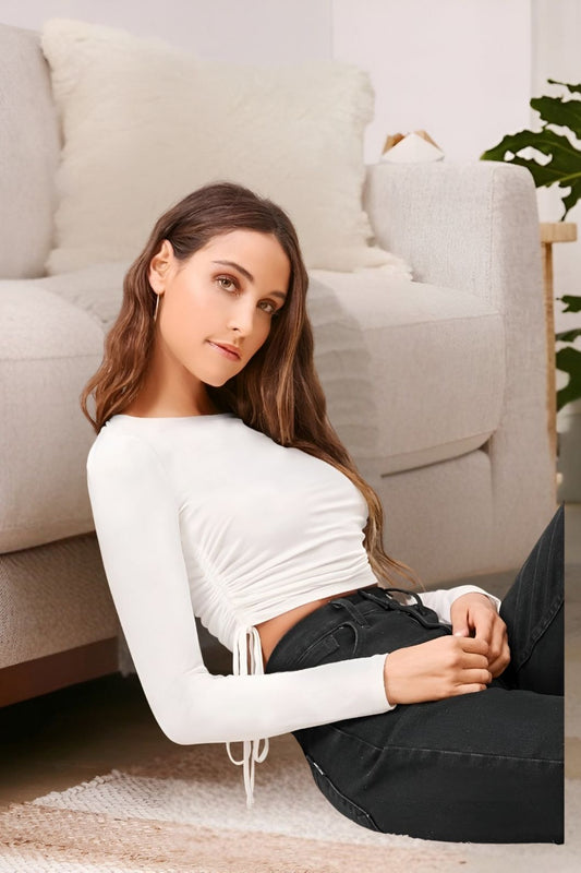 Side profile of white round neck polyester top in palace setting