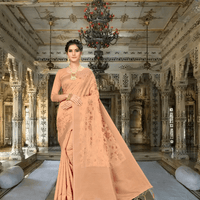 Model in beige Banarasi cotton saree with gold border in palace room