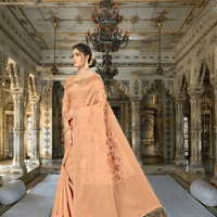 Detailed golden pattern on beige handspun Banarasi cotton saree indoors