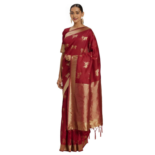 Close-up of gold elephant zari on deep red Banarasi silk in heritage setting
