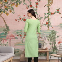 Back view of CELESTINA pista green kurti