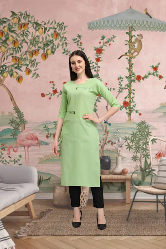 Front view of pista green cotton straight kurti in palace setting
