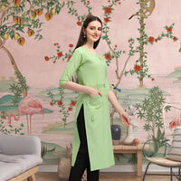 Left profile of pista cotton straight kurti styled indoors