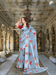 Light blue satin patta saree with crimson blouse by lake