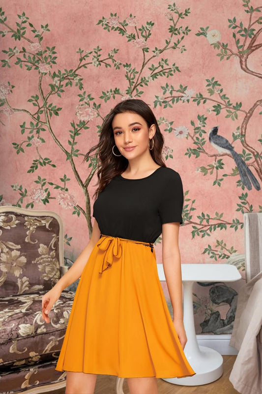 Front view of The Solar Requiem dress with yellow skirt and black top