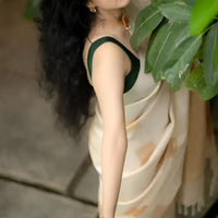 Studio top shot of off-white printed silk saree