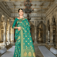 Model in green Banarasi silk saree with golden motifs in palace background