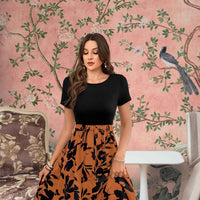 Close-up of floral prints on orange skirt