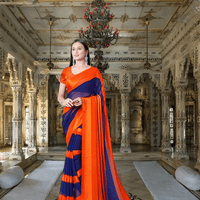 Woman twirling orange-to-navy solid saree in desert sunset