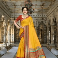 Model draped in yellow Kota Doria saree, golden light catching tri-colored border inside a palace archway