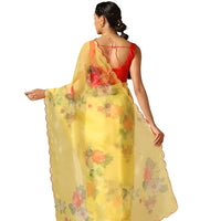 Back view showing the airy drape of the yellow printed saree