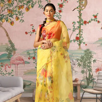 Front view of yellow organza saree with soft floral print