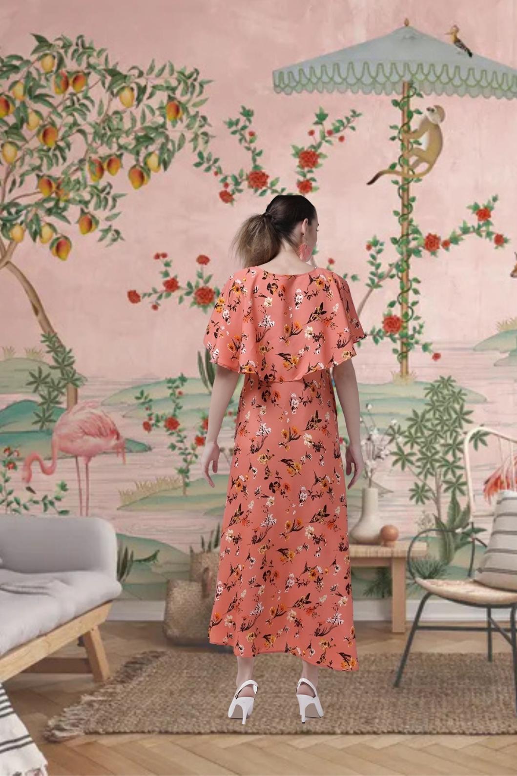 Back view of CELESTINA’s orange floral gown in royal setting