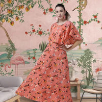 Front view of orange floral full-length crepe gown in palace interior
