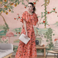 Side profile of SuryaLeela orange gown with floral print