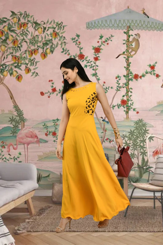 Right angle of yellow crepe gown with floor-length finish
