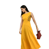 Studio right profile of bright yellow floor-length gown