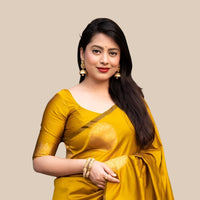 Studio front view of yellow printed silk saree