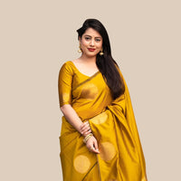 Studio front view of yellow printed silk saree