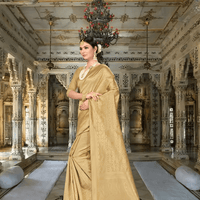 Close-up of intricate zari designs on luminous golden fabric