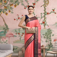 Front view of pink checkered saree in elegant indoor setting