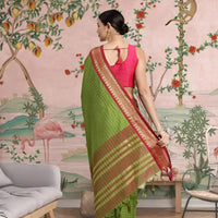  Rear shot showing green pallu draped with timeless grace