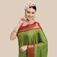 Studio front shot of white checkered saree with deep Mehendi blouse