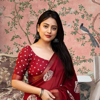  Front view of red cotton crape saree glowing in heritage palace light