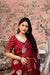  Front view of red cotton crape saree glowing in heritage palace light