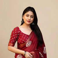 Studio front view of red saree showing structure and blouse pairing
