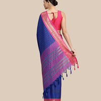 Rear view with plain backdrop showing clean pallu structure
