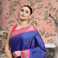 Front view of royal blue checkered saree in elegant palace setting