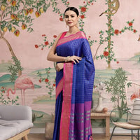 Front view of royal blue checkered saree in elegant palace setting