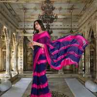 Bride walking in pink-navy saree with gradient pallu flowing