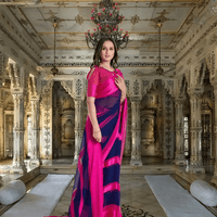 Bride walking in pink-navy saree with gradient pallu flowing