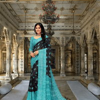 Woman wearing Twilight Teal georgette saree in palace setting