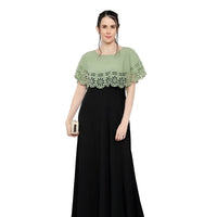 Studio front view of green black sleeveless crepe gown