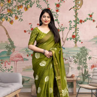 Front view of 💚 Vaidarbhi green cotton crape saree styled in ethnic decor