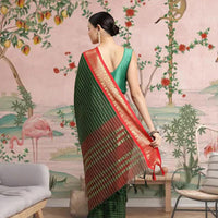  Rear profile showing green pallu draped in traditional elegance