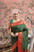 Front view of bottle green cotton silk checkered saree glowing in royal setting