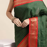 Studio close-up of bottle green pallu texture and weave