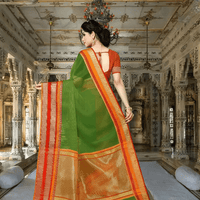 Rear shot showing full fall of pallu bordered in gold-pink against deep green fabric