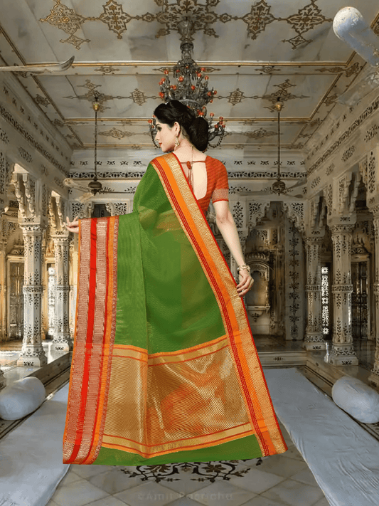 Rear shot showing full fall of pallu bordered in gold-pink against deep green fabric