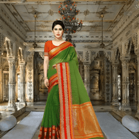 Model walking through palace corridor, dark green saree glowing 