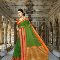 Graceful pose in forest stone backdrop, dark saree draped elegantly