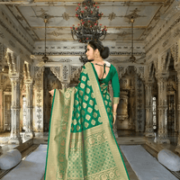 Golden border of green Banarasi saree gleaming in heritage setting