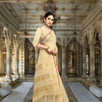 Serene seated pose in temple corridor, contrast red blouse balancing soft beige drape