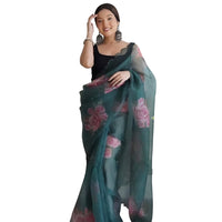  Front view of green organza printed saree in royal palace setting by CELESTINA