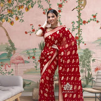 Front view of red Arani Pattu saree glowing in traditional palace setting