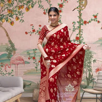 Front view of red Arani Pattu saree glowing in traditional palace setting